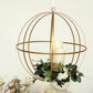 Gold wrought iron open frame centerpiece ball with candles and floral display.