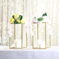 Gold rectangular flower stands with floral arrangements, perfect for weddings.