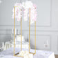 Gold rectangular wedding flower stand with pink floral arrangement.