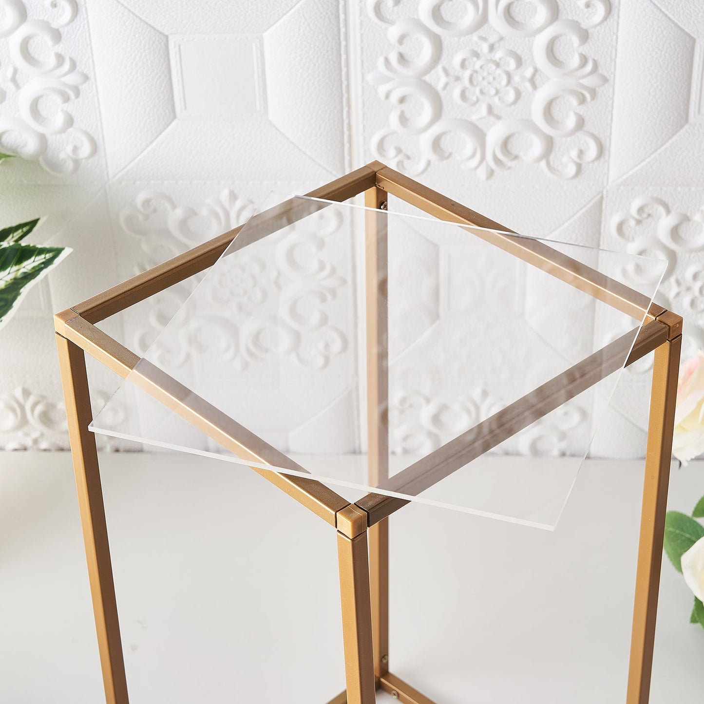 Clear acrylic sheets on a gold metal table.
