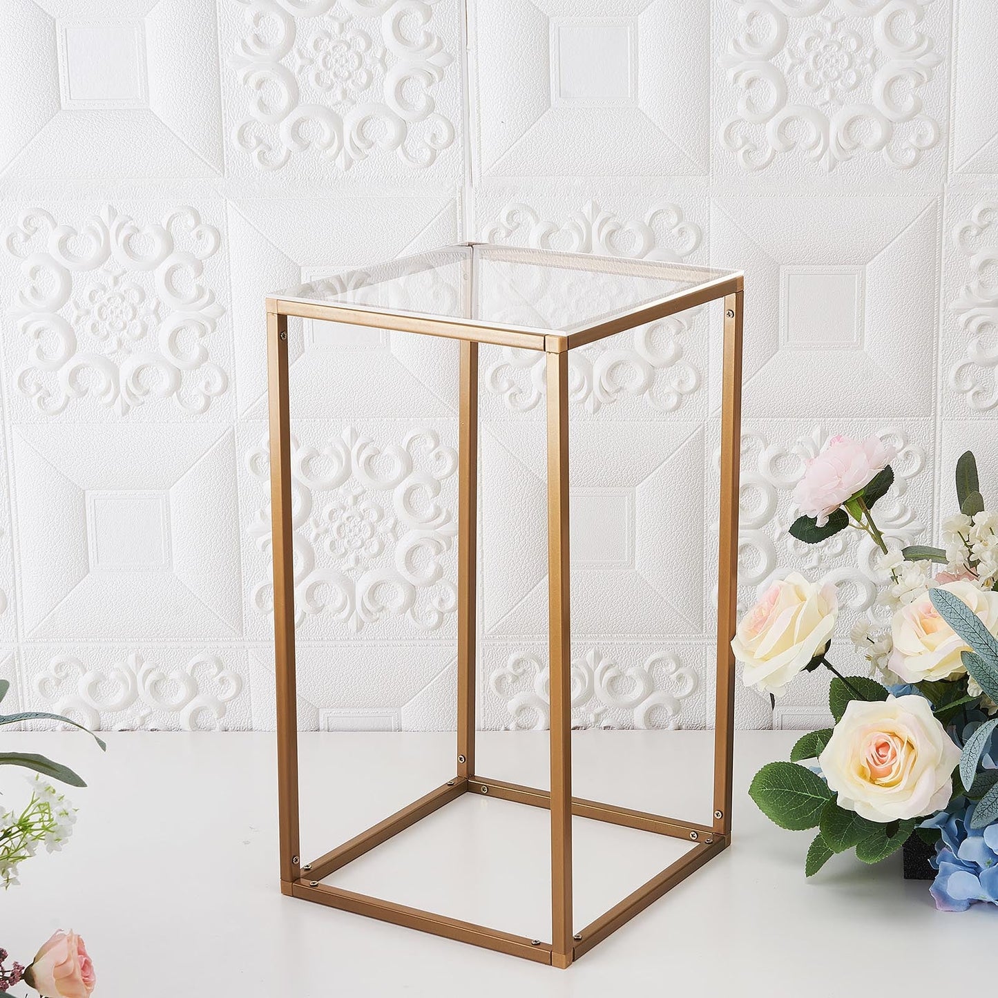 Clear acrylic plexiglass sheets on a decorative table with flowers.