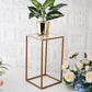 Clear acrylic plexiglass sheets on a gold plant stand with decorative flowers.