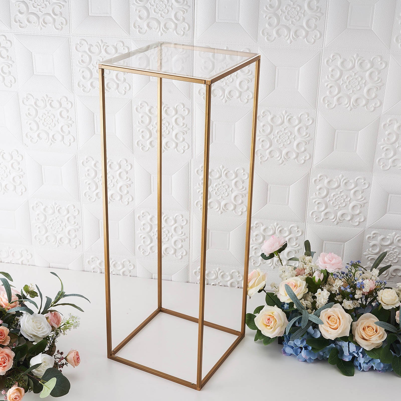 Clear acrylic plexiglass sheets on a display stand with flowers.