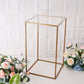 Clear acrylic plexiglass sheets with a gold frame and floral arrangement.