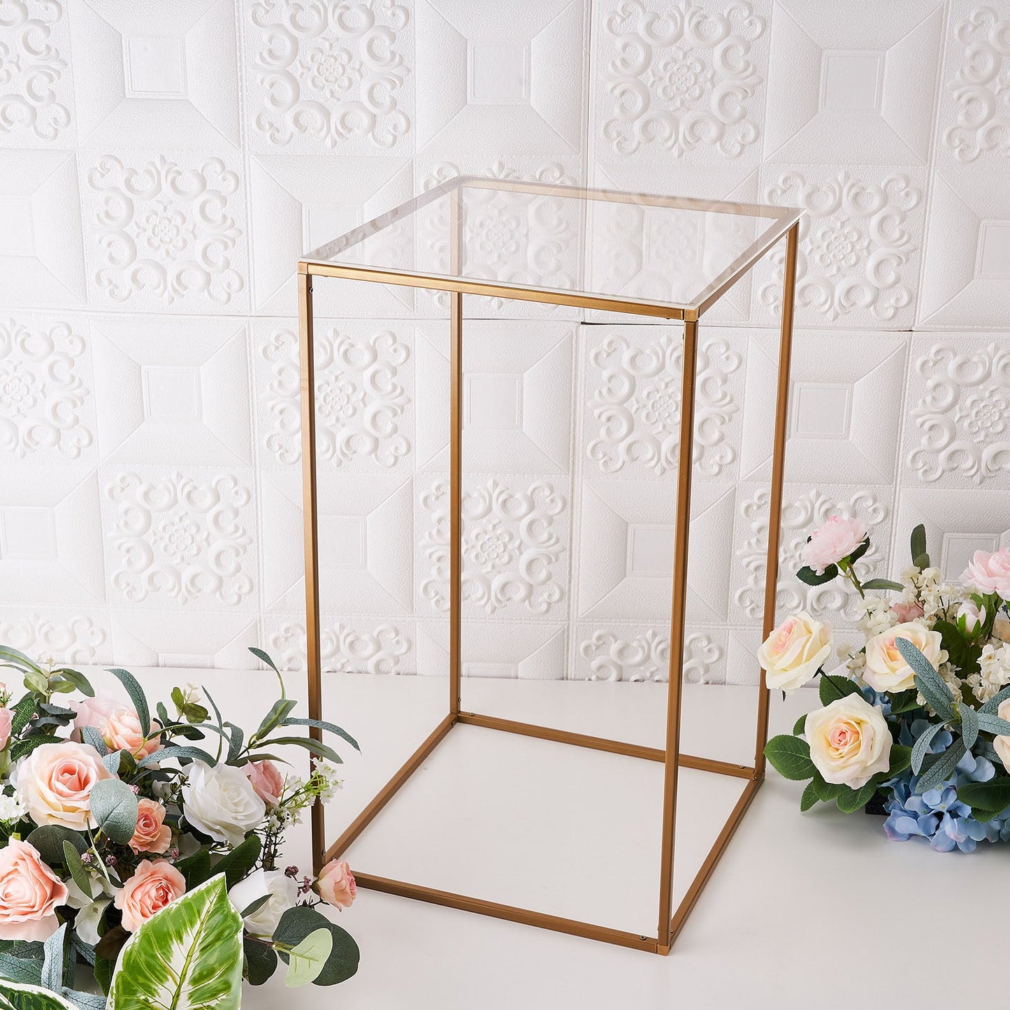 Clear acrylic plexiglass sheets with a gold frame and floral arrangement.
