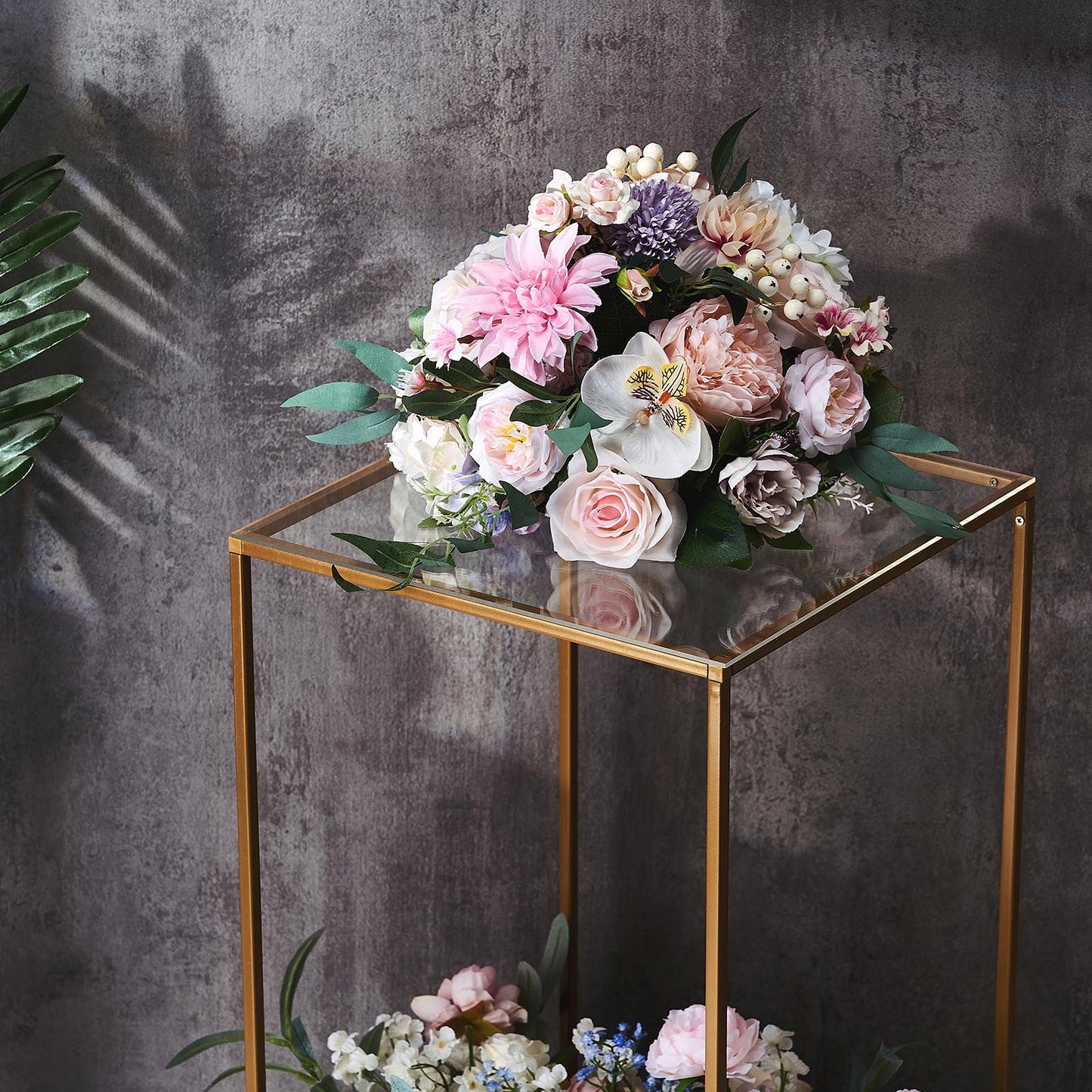 Clear acrylic plexiglass sheets on a floral display table.