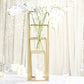 Matte gold metal frame flower stand centerpiece with elegant white orchids.