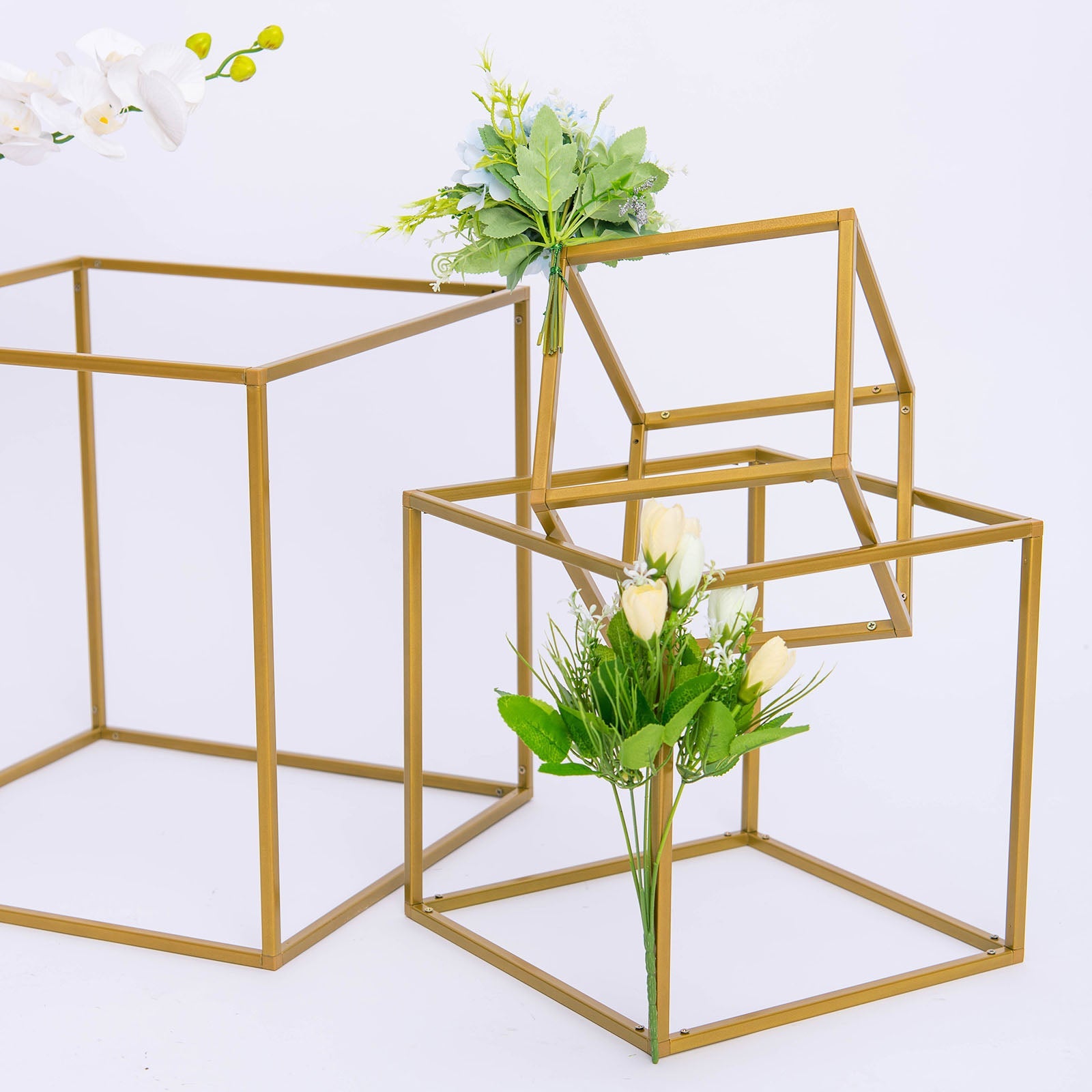 Gold metal geometric flower stands for wedding centerpieces.