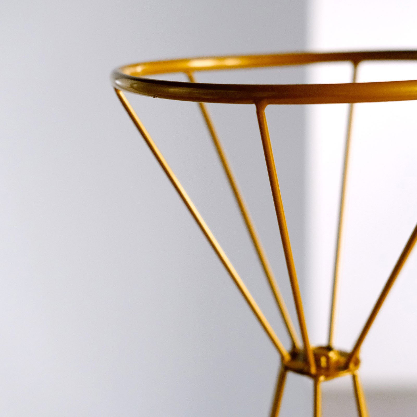 Gold metal geometric flower stand vase centerpiece.