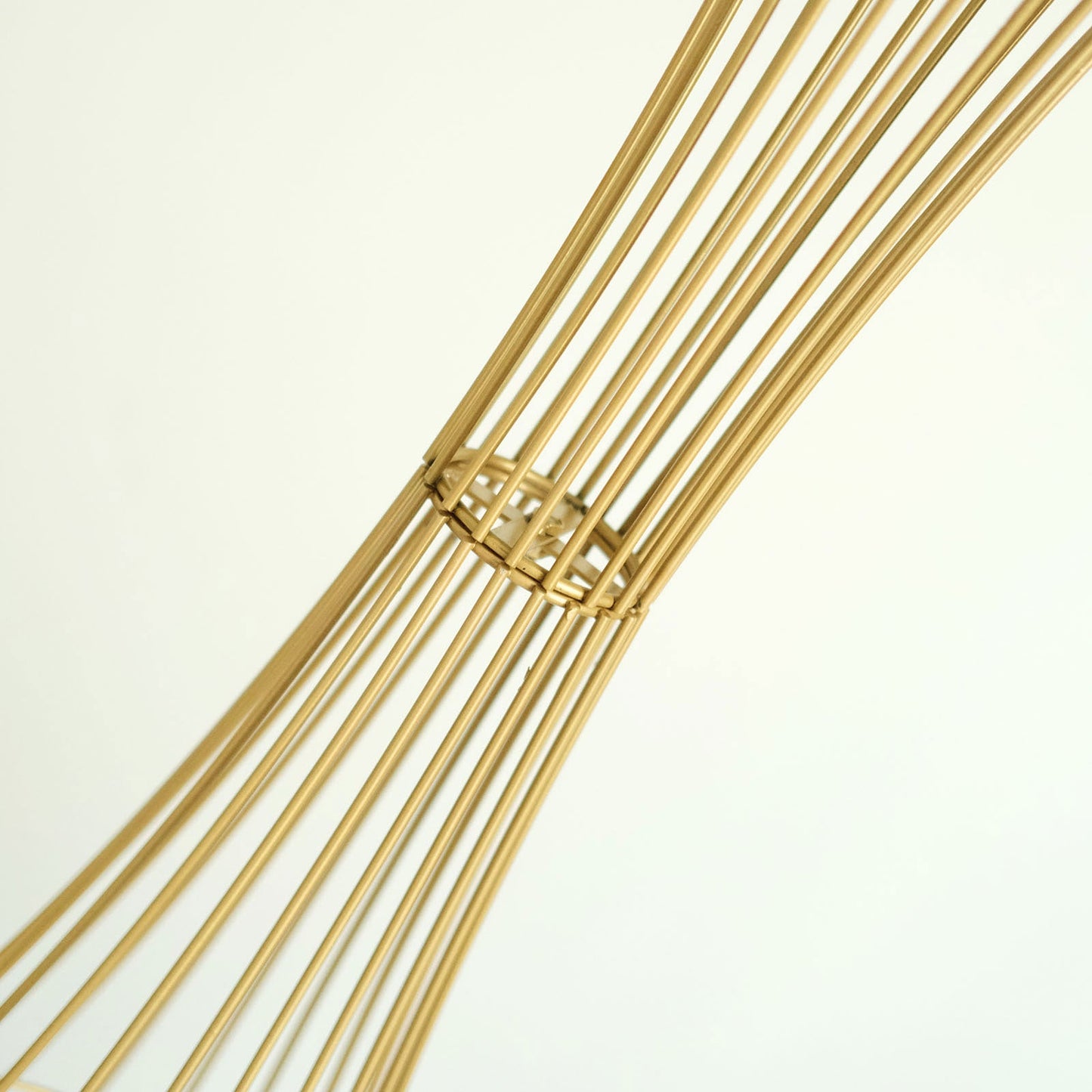 Gold metal wire trumpet-shaped flower centerpiece stand.