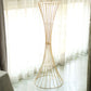 Gold metal wire trumpet-shaped flower centerpiece stand.
