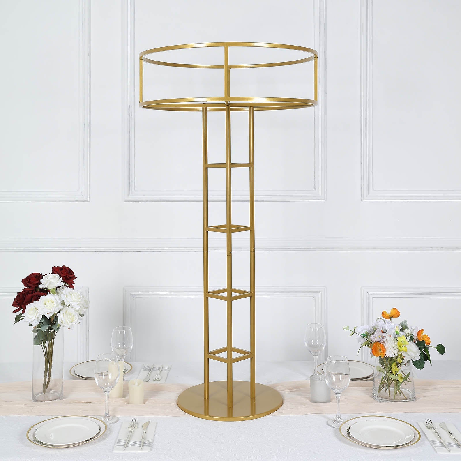Gold floral riser wedding centerpiece stand with open frame design.