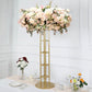 Tall gold floral riser centerpiece with pink and white flowers.
