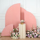 Matte dusty rose spandex half moon backdrop stand covers with floral arrangements.