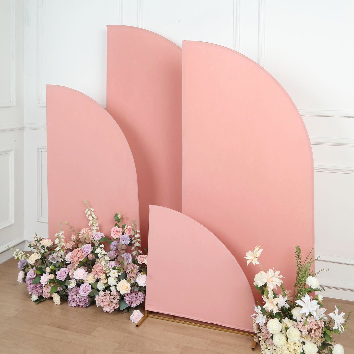 Matte dusty rose spandex half moon backdrop stand covers with floral arrangement.