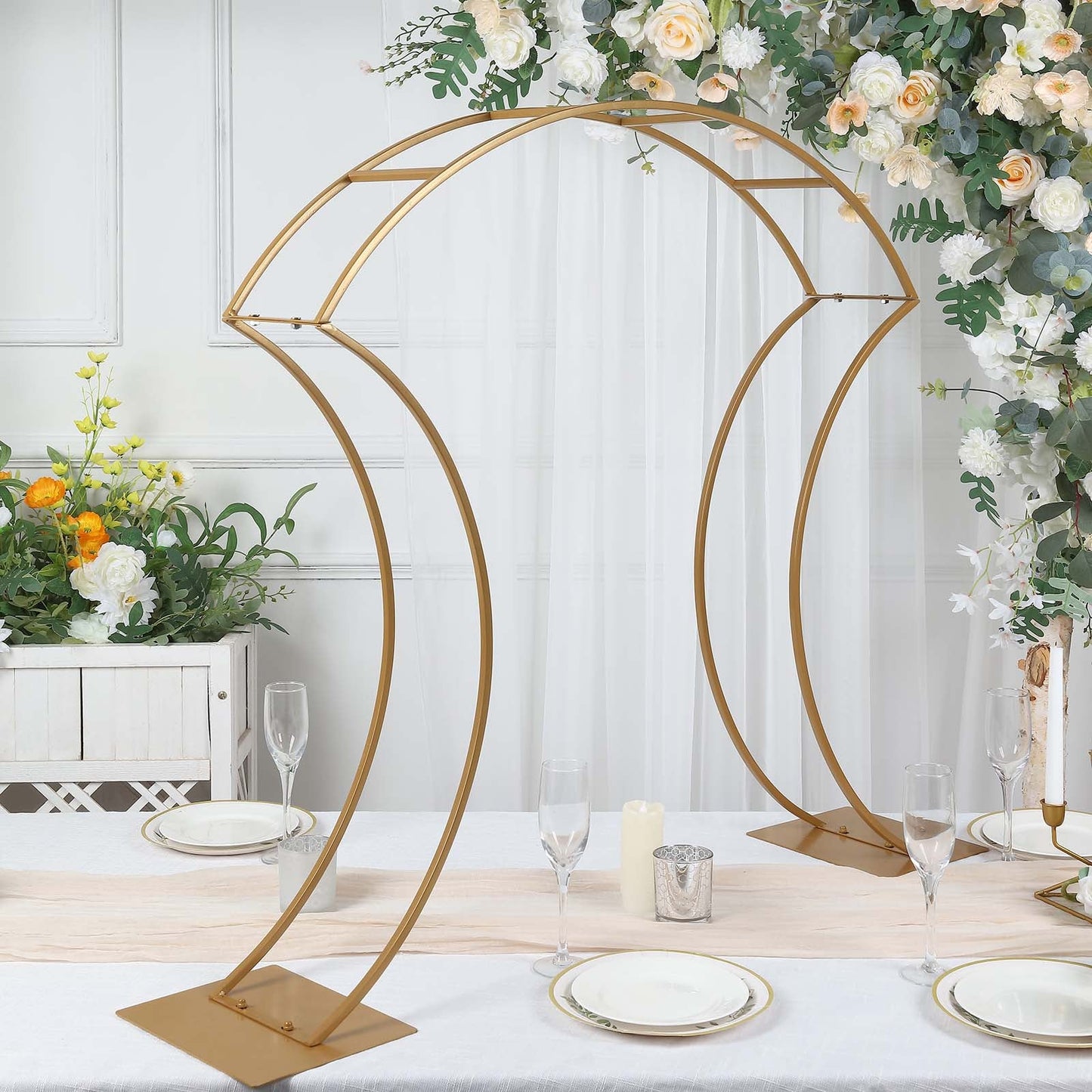 Gold floral arch frame wedding centerpiece stand with curvy design.