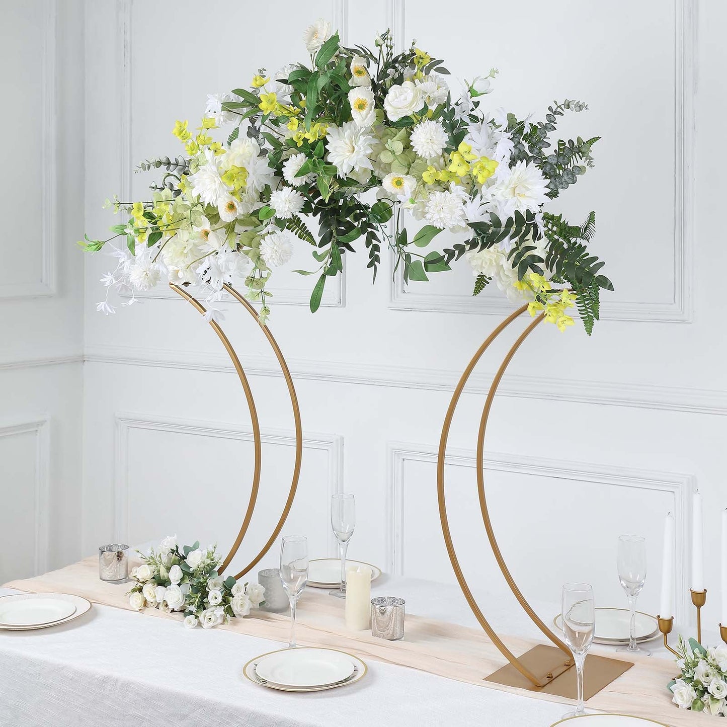 Gold floral arch centerpiece stand with curvy design for weddings.