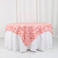 Dusty rose 3D rosette satin table overlay on a white table.