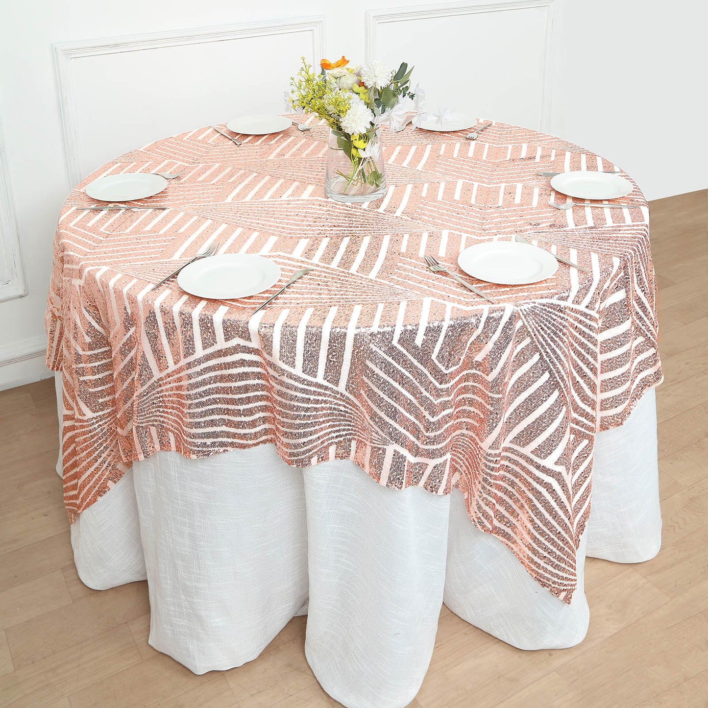 Blush diamond glitz sequin table overlay topper on a round table.