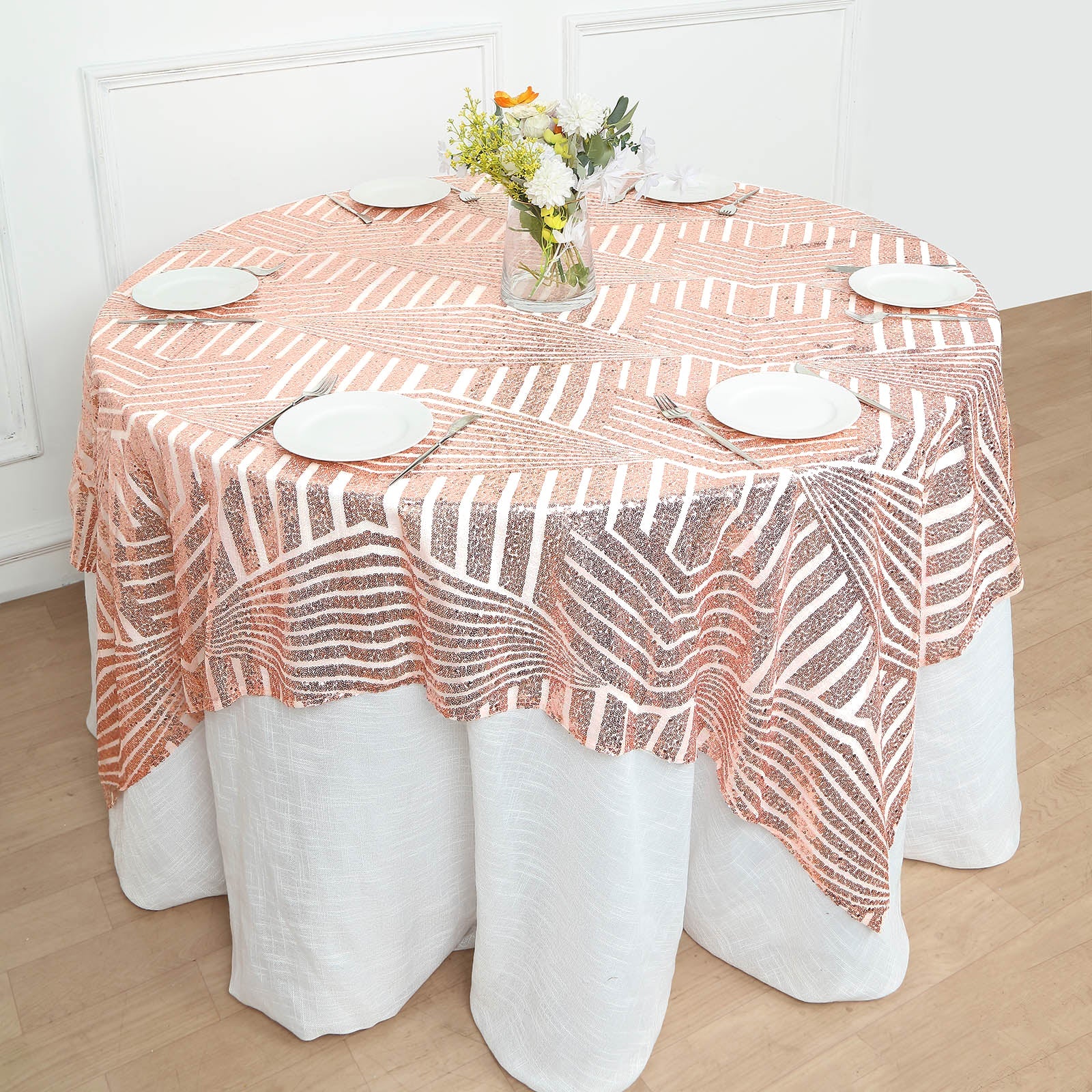 Blush diamond glitz sequin table overlay topper on a round table.