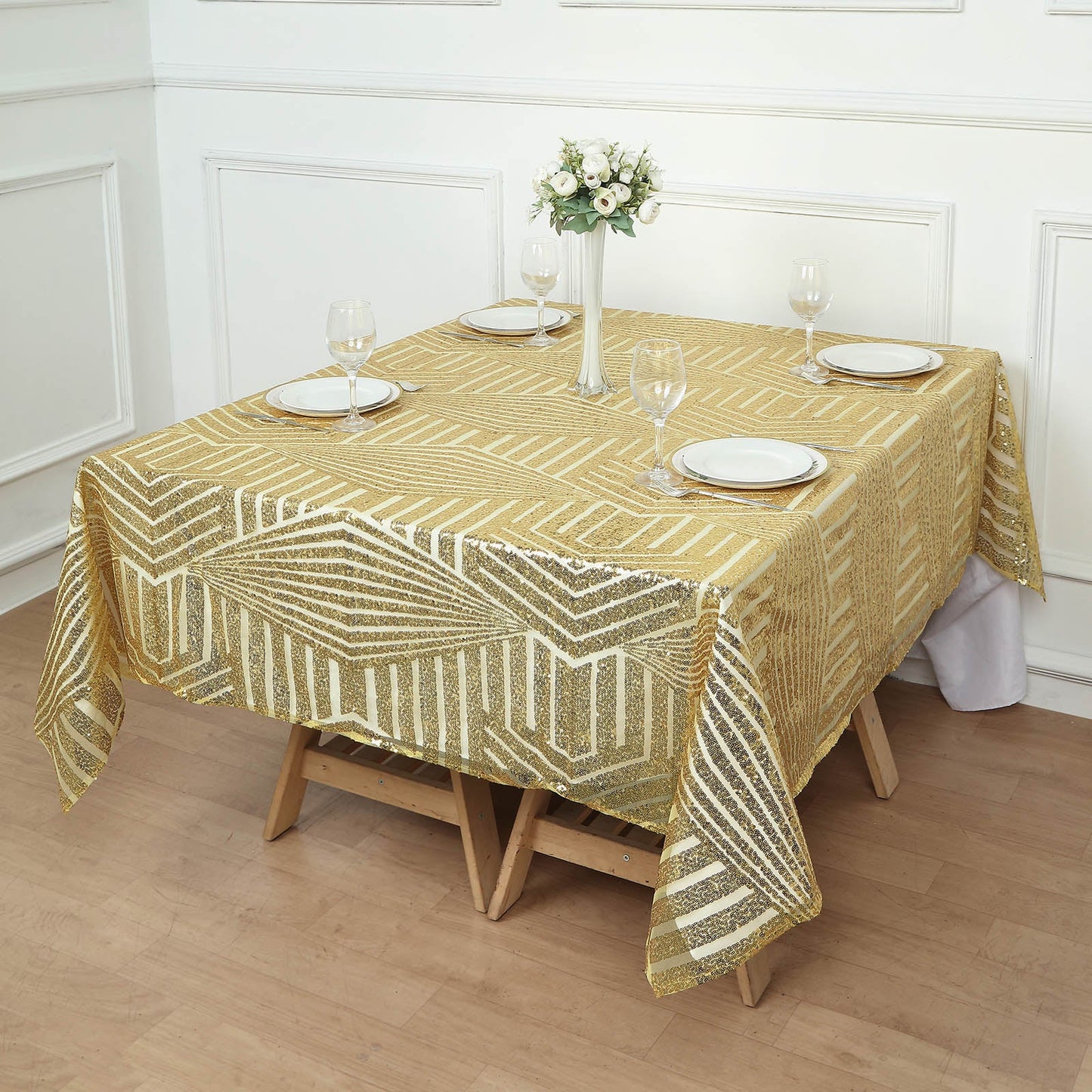 Gold sequin table overlay topper with geometric design on a dining table.