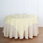 Ivory textured linen square table overlay on a round table.