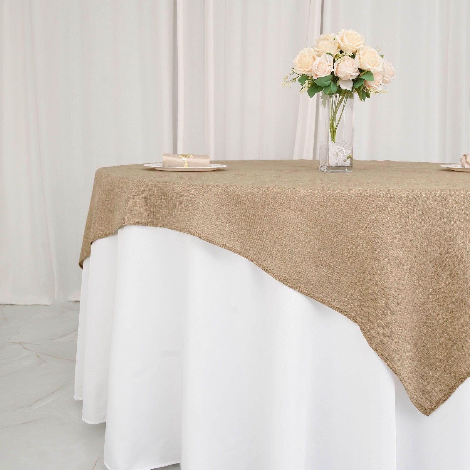 Natural faux jute burlap square table overlay on a white tablecloth.