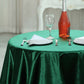 Hunter emerald green velvet table overlay on a round table setting.