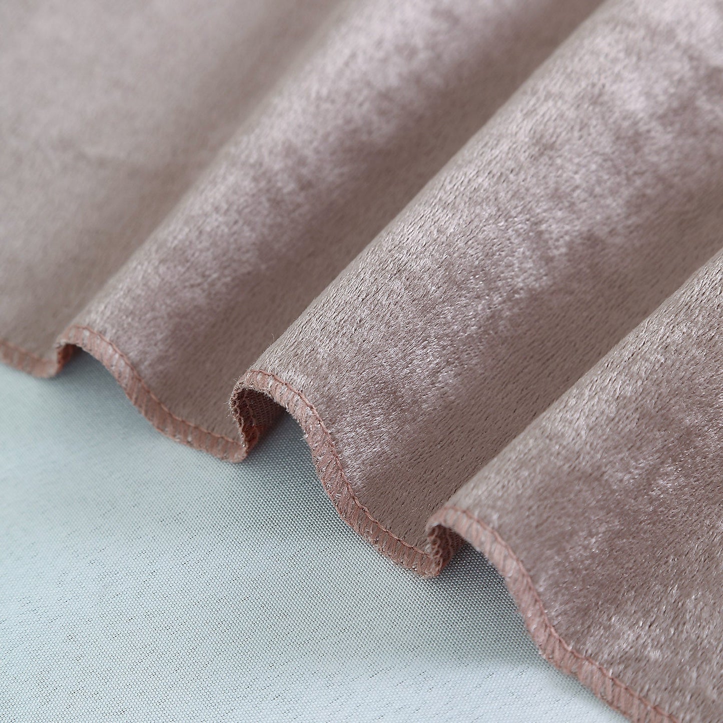 Mauve velvet table overlay with soft texture and elegant finish.