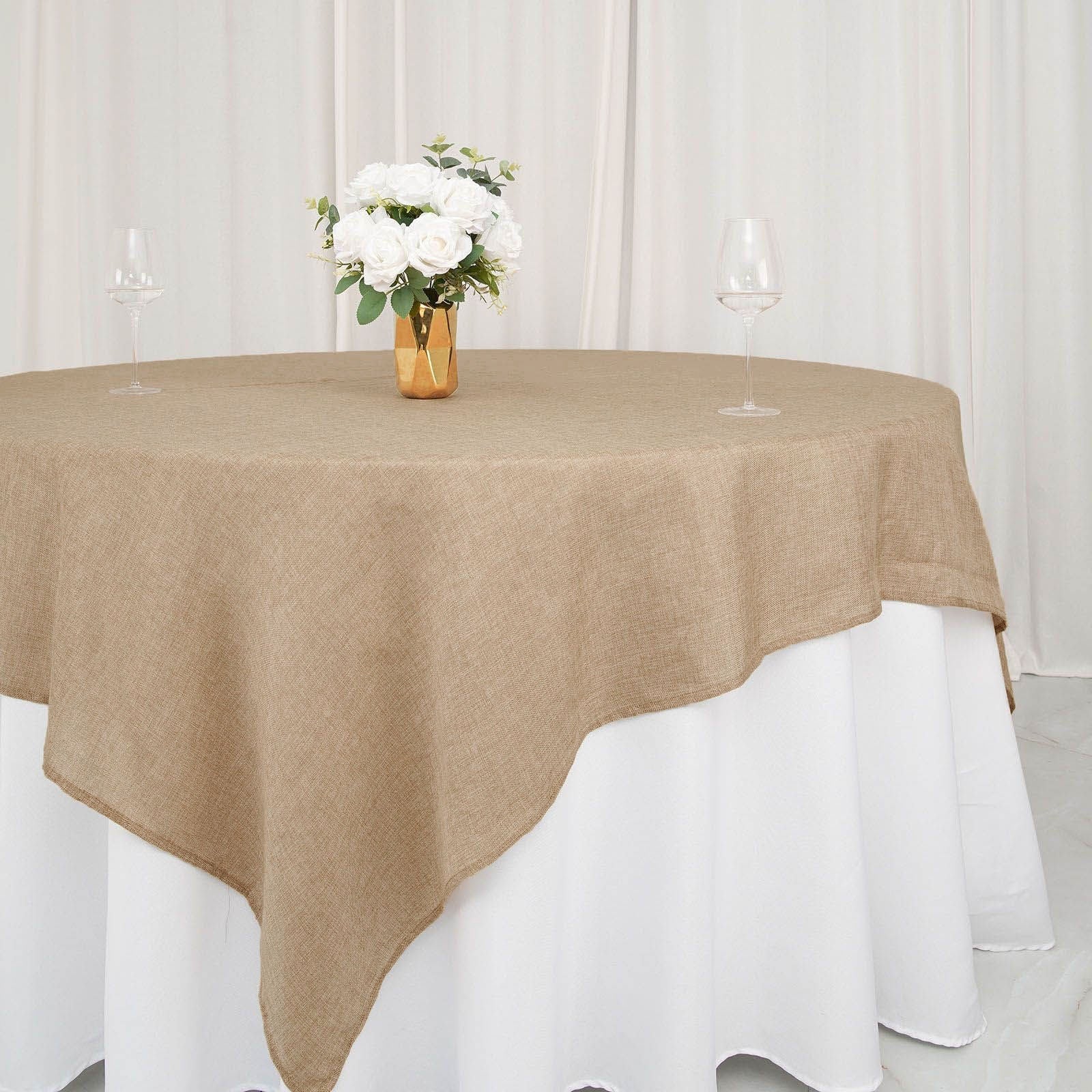 Natural boho chic faux burlap jute table overlay in light brown.