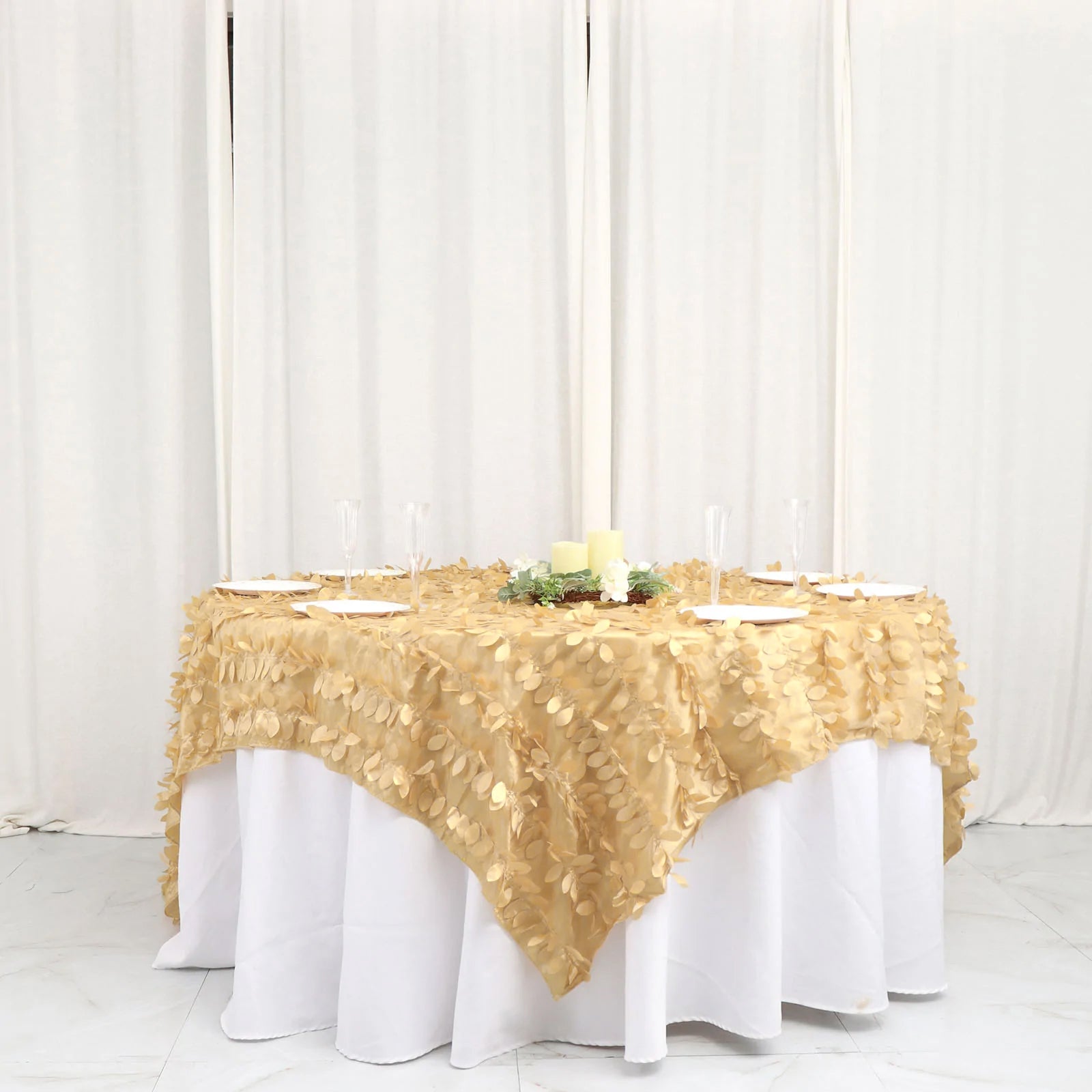 Champagne leaf petal taffeta table overlay on a round table.