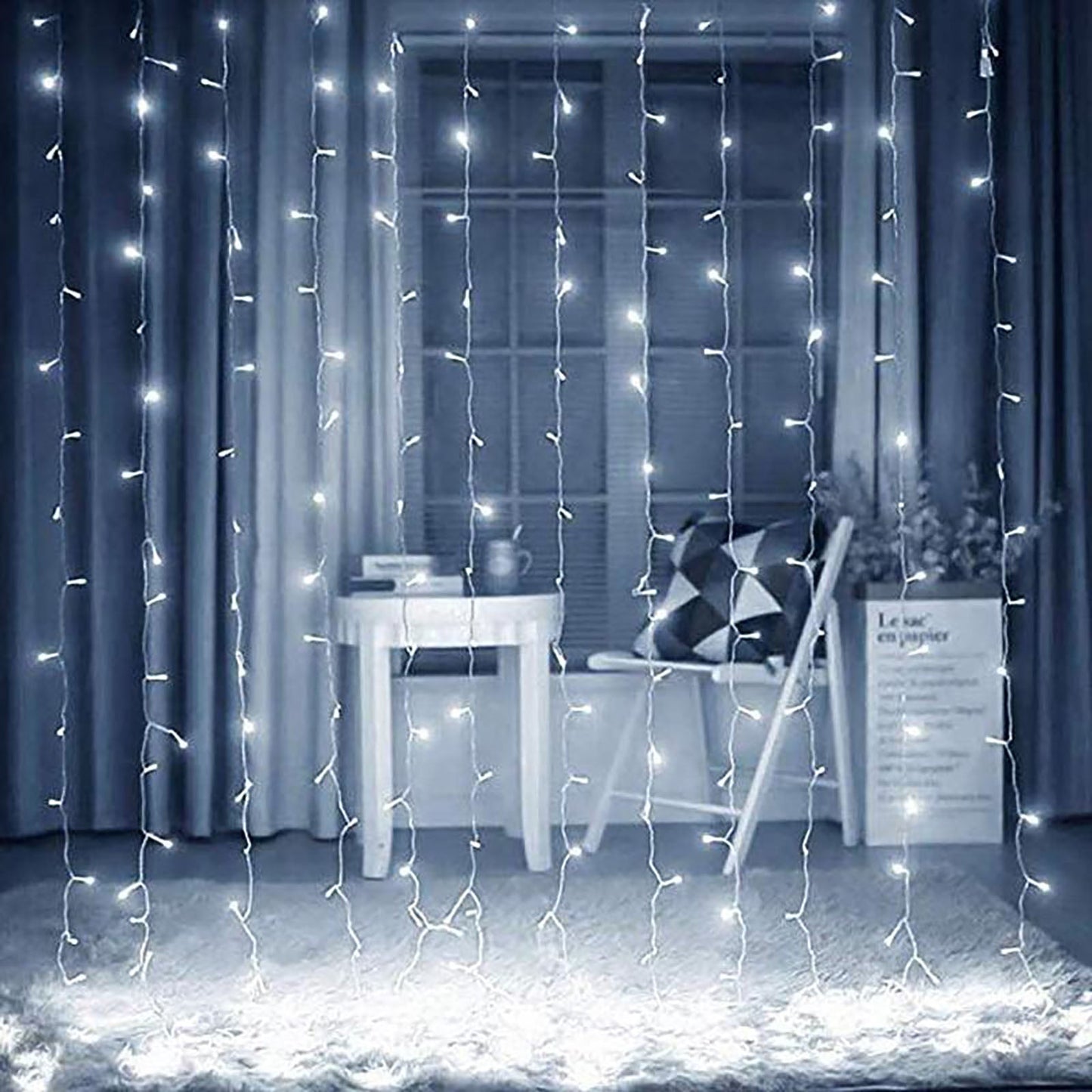 Cool white 300 LED icicle curtain fairy string lights in a decorative indoor setting.