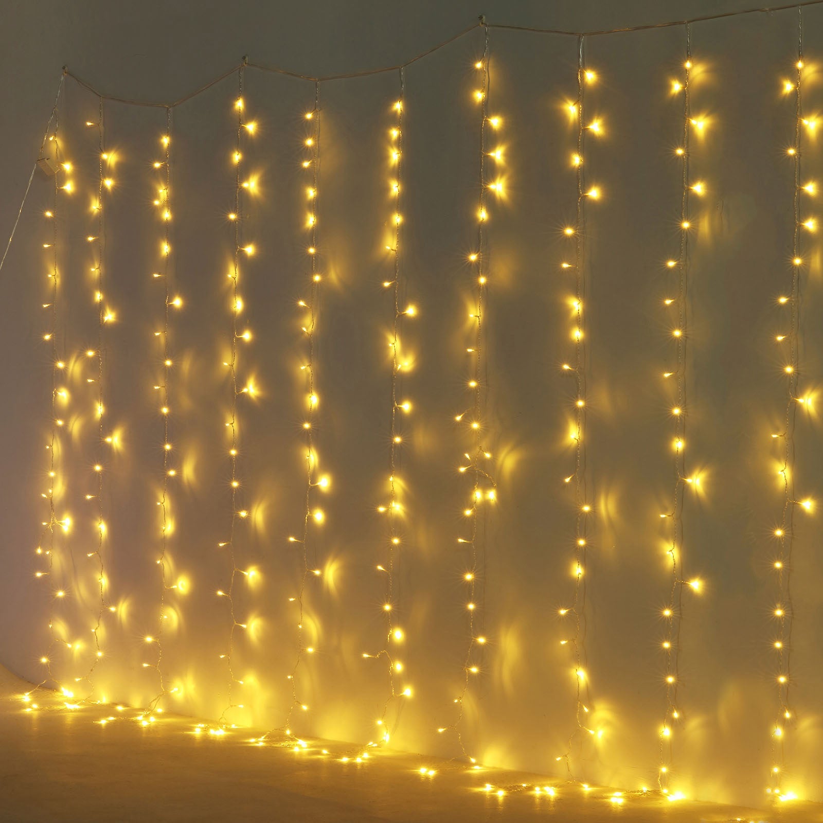 Warm white 300 LED icicle curtain fairy lights with 8 modes. #whtbkgd