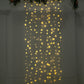 Warm white LED icicle curtain fairy string lights, 5ft x 8ft, 192 LEDs.