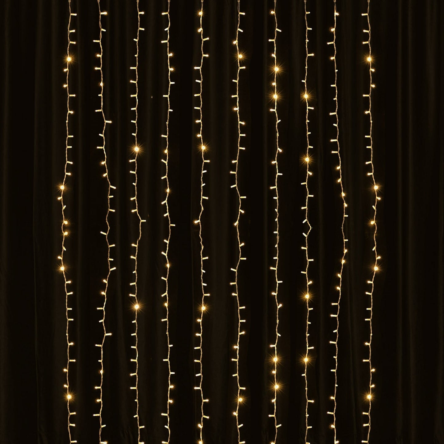 Warm white 192 LED icicle curtain string lights in a dark setting.