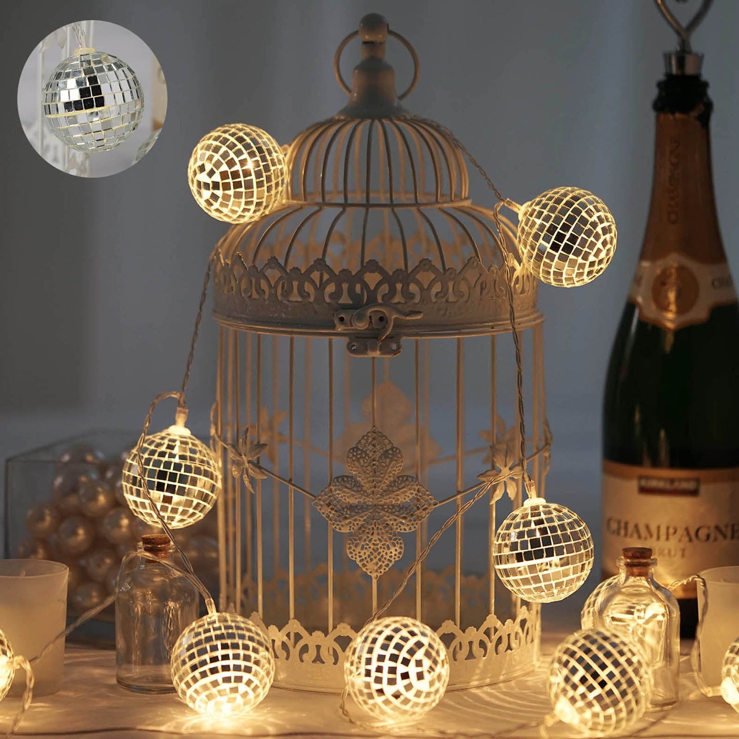 6ft silver disco mirror ball LED string light garland with warm white glow.