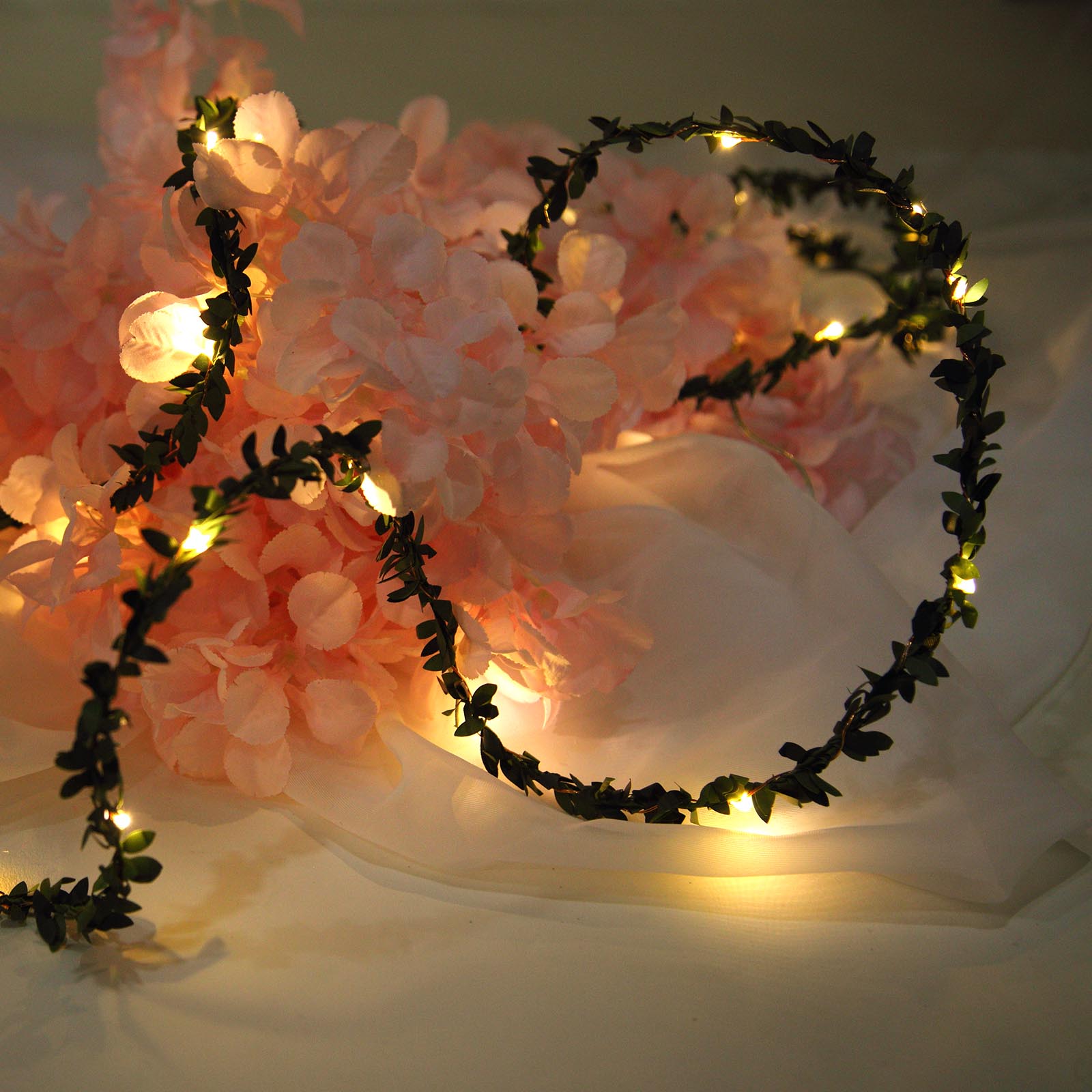 Green leaf fairy string lights with white light.