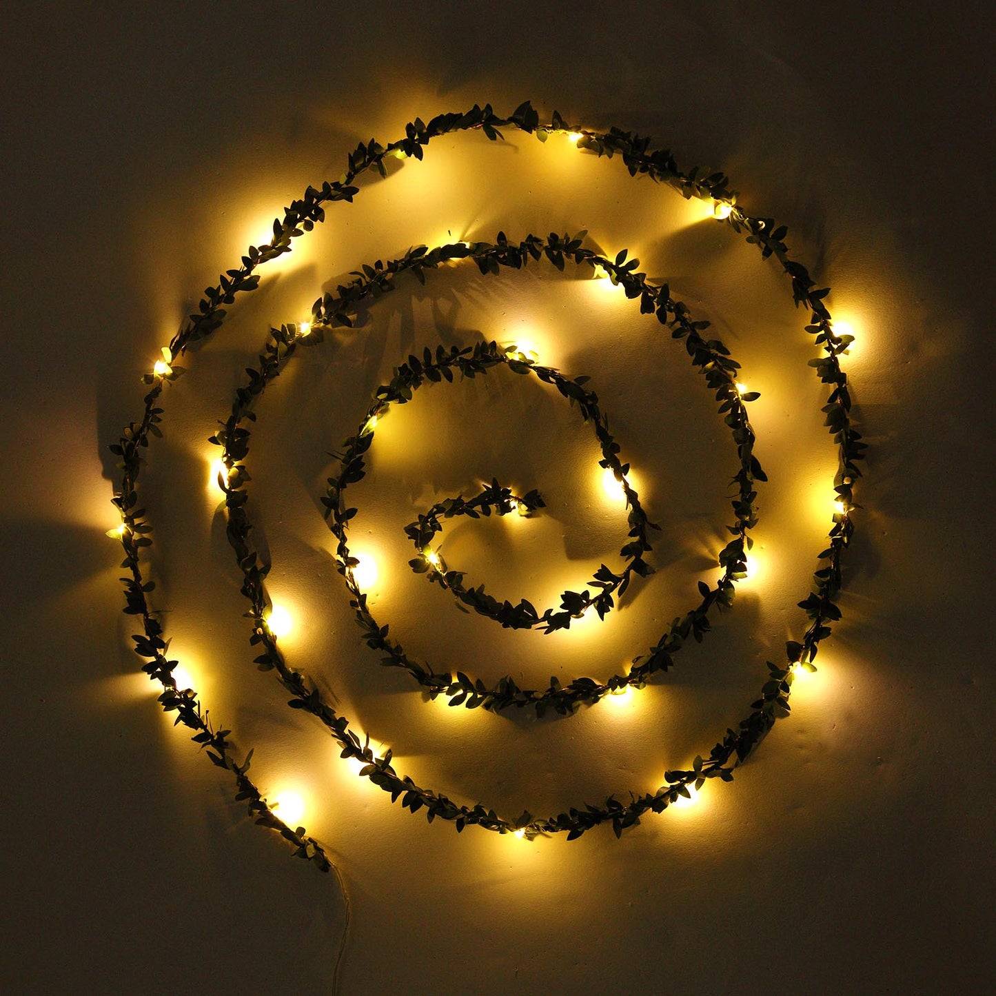 Green leaf fairy string lights with warm white LED glow.