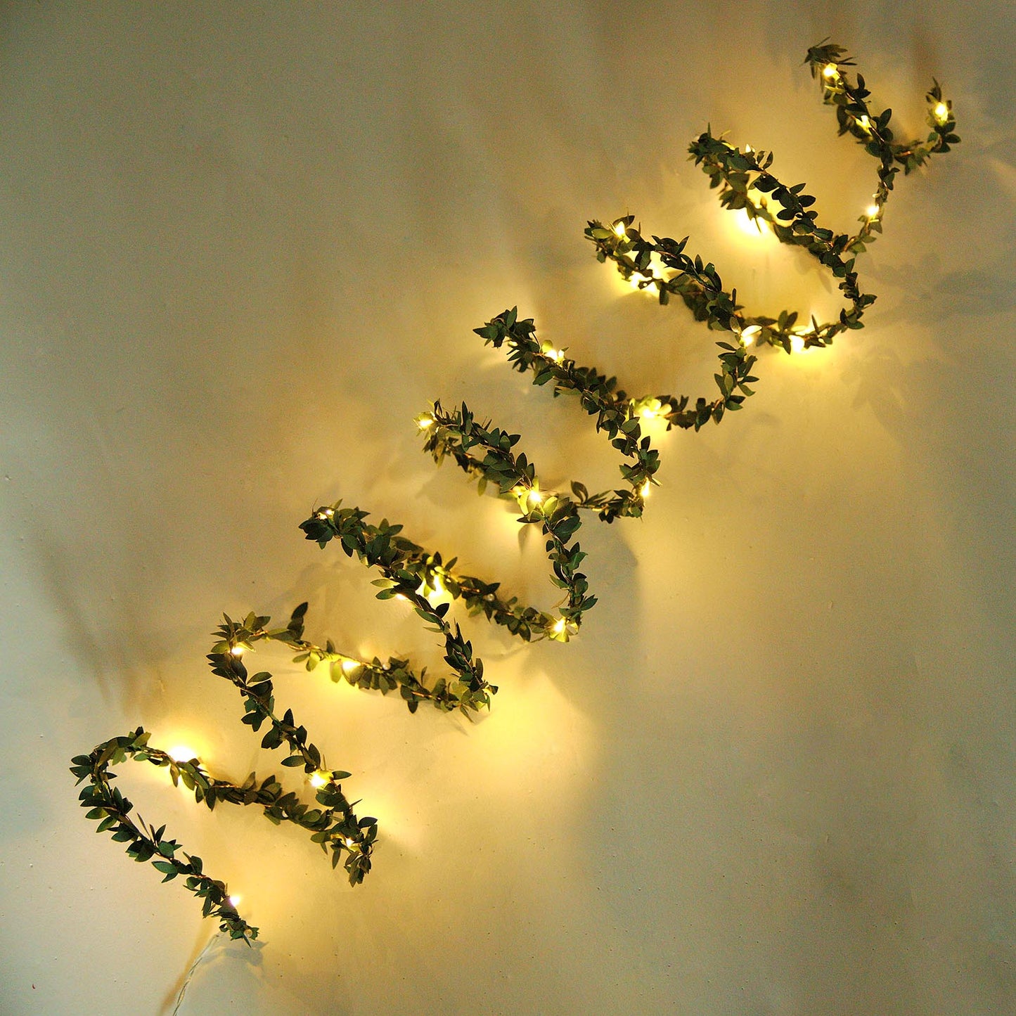 10ft green leaf fairy string lights with white LED bulbs.