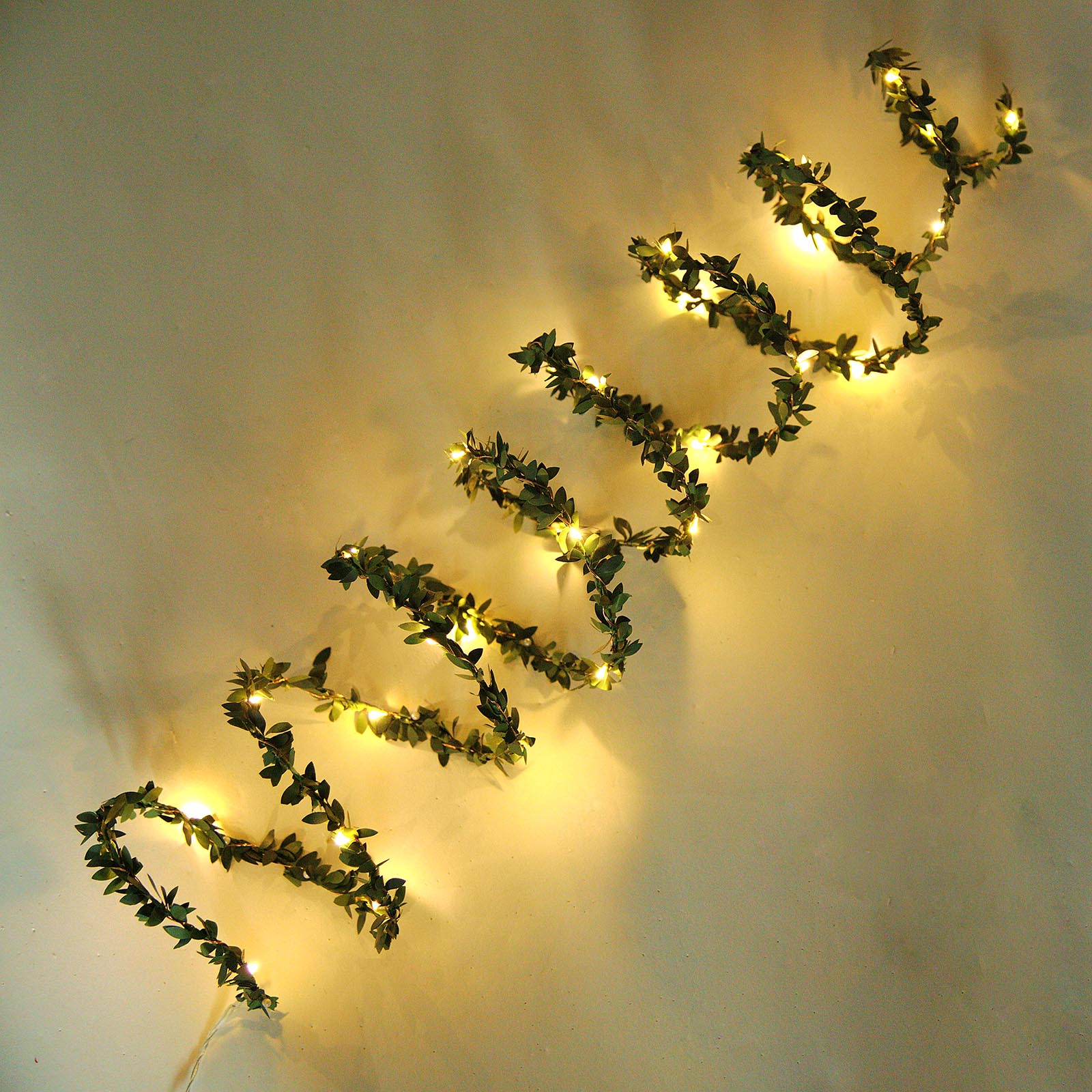10ft green leaf fairy string lights with white LED bulbs.