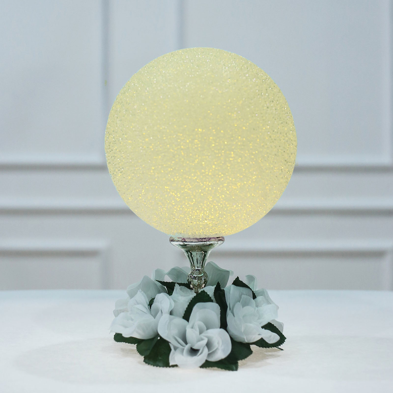 Color Changing LED Ball Light Centerpiece in soft yellow glow.