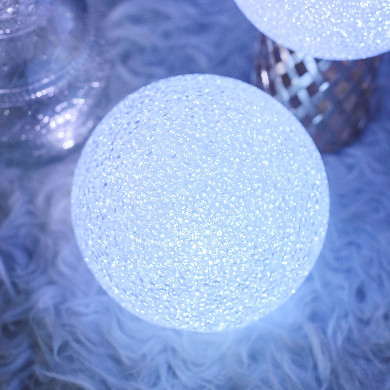 Color Changing LED Ball Light Centerpiece in soft blue glow.