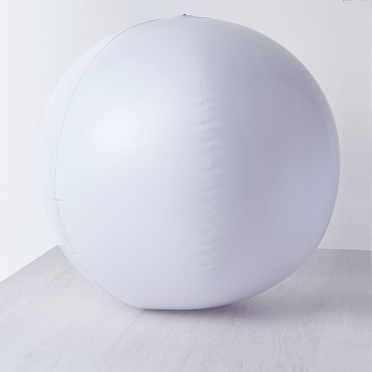 White floating pool light up glow ball for outdoor garden decor.