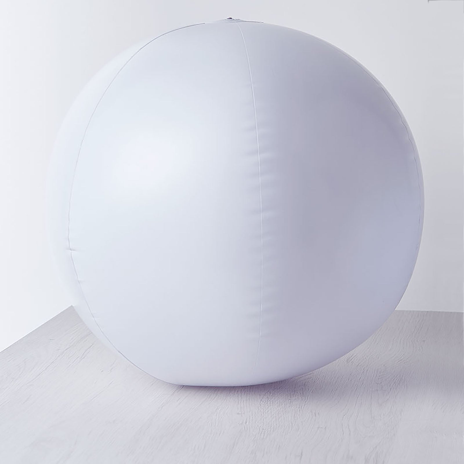 White floating pool light up glow ball for outdoor garden decor.