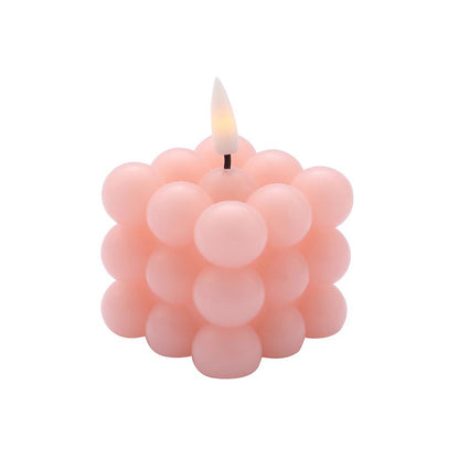 Blush LED bubble candle, flameless and flickering, warm white light.