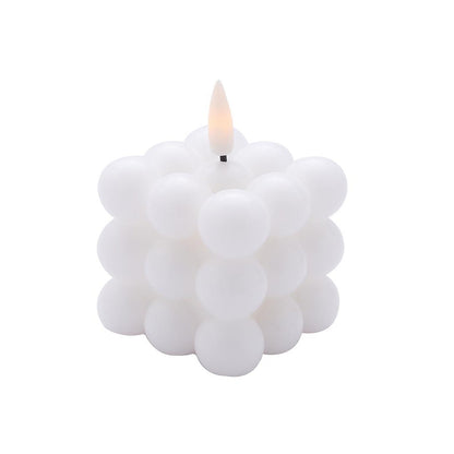 White LED bubble candle, flameless and flickering, warm white glow.