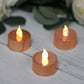 Metallic rose gold LED tealight candles with a warm glow.