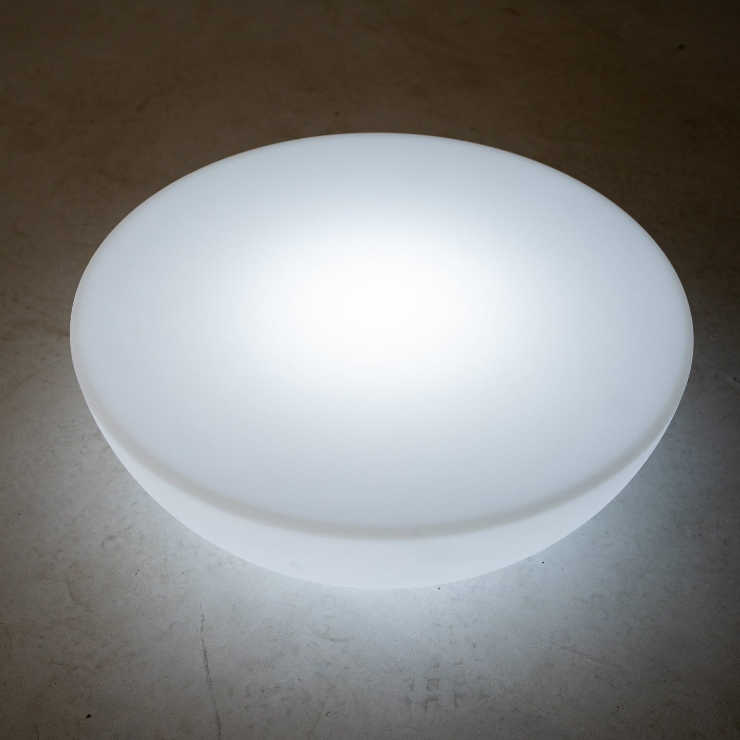 White color changing cordless LED half circle table light.