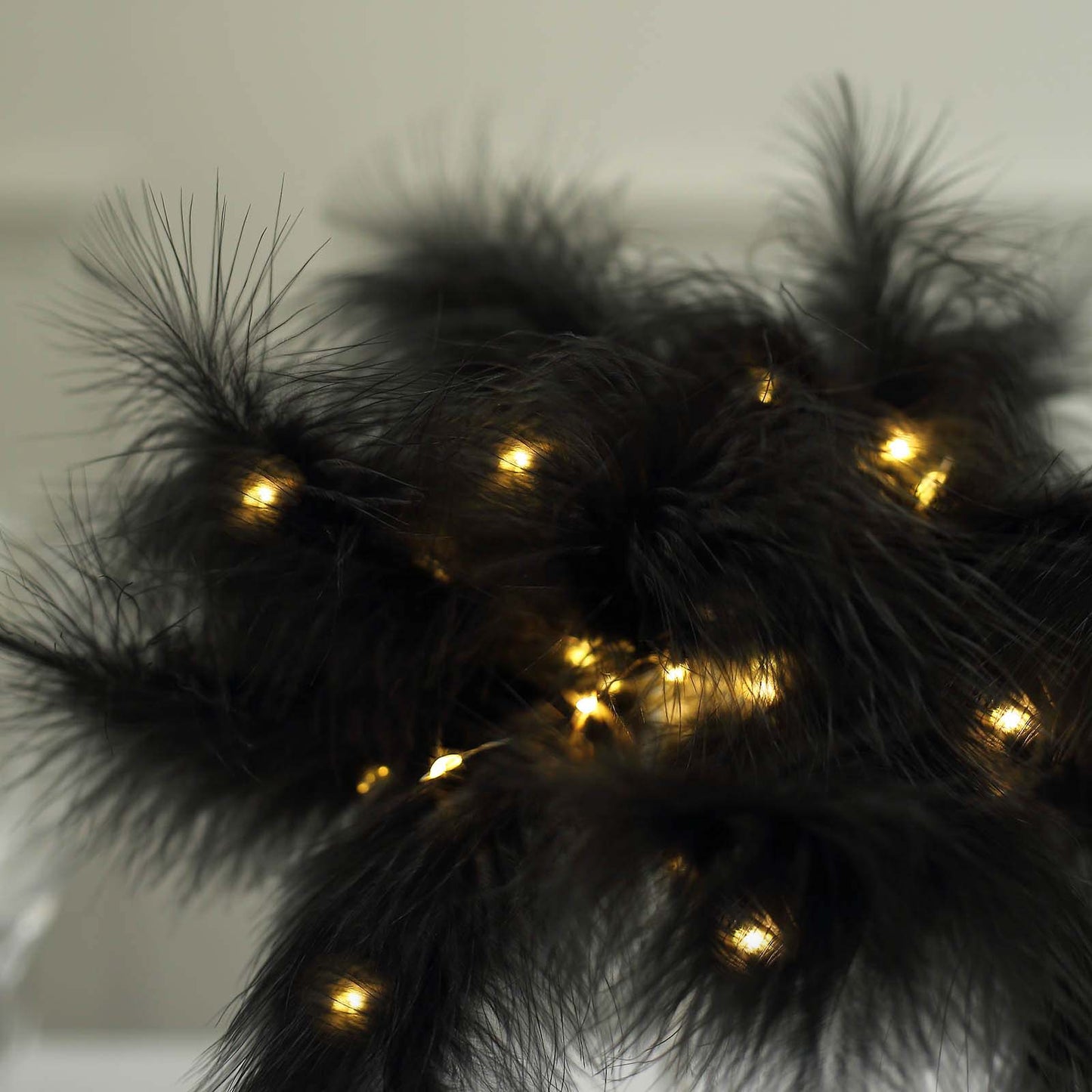 Black feather table lamp with LED lights for wedding centerpiece.