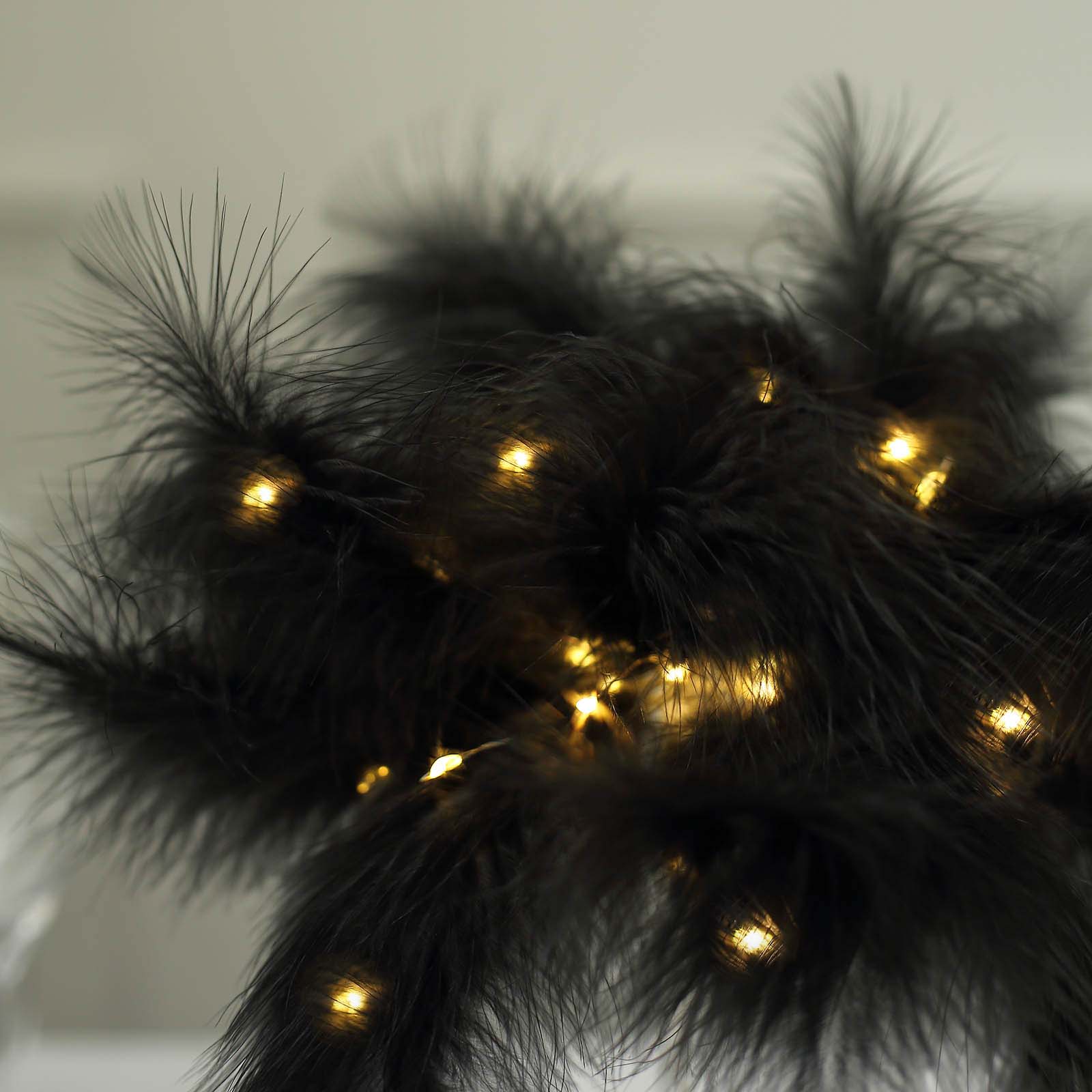 Black feather table lamp with LED lights for wedding centerpiece.